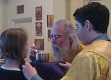 Holy Communion was distributed to the faithful by His Eminence, Archbishop Job